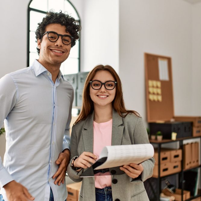 Two,Business,Workers,Smiling,Happy,Holding,Clipboard,Standing,At,The Two,Business,Workers,Smiling,Happy,Holding,Clipboard,Standing,At,The