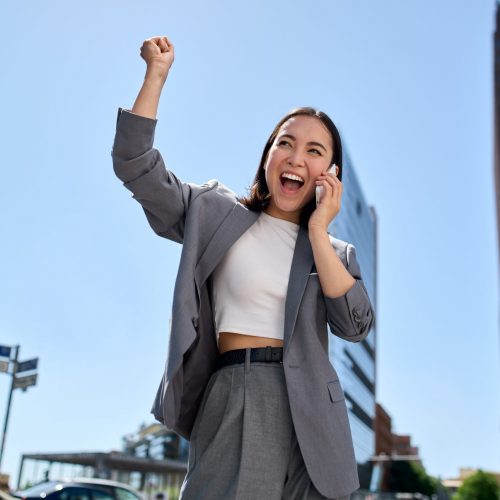 Young,Happy,Excited,Asian,Business,Woman,Entrepreneur,Winner,Standing,On Young,Happy,Excited,Asian,Business,Woman,Entrepreneur,Winner,Standing,On